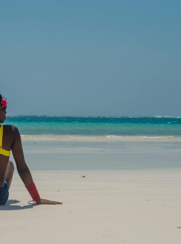 Photo of Woman Sitting on Seashore