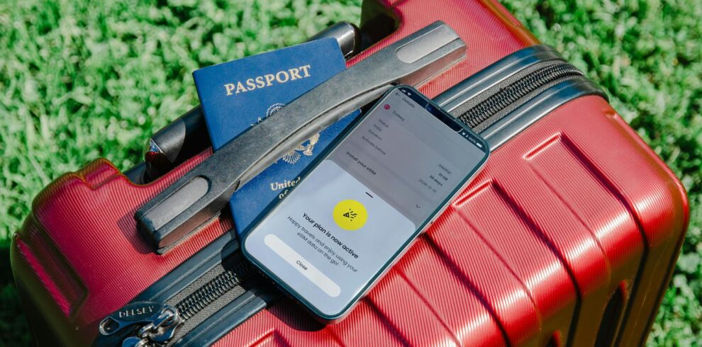 Smartphone and Passport on Suitcase