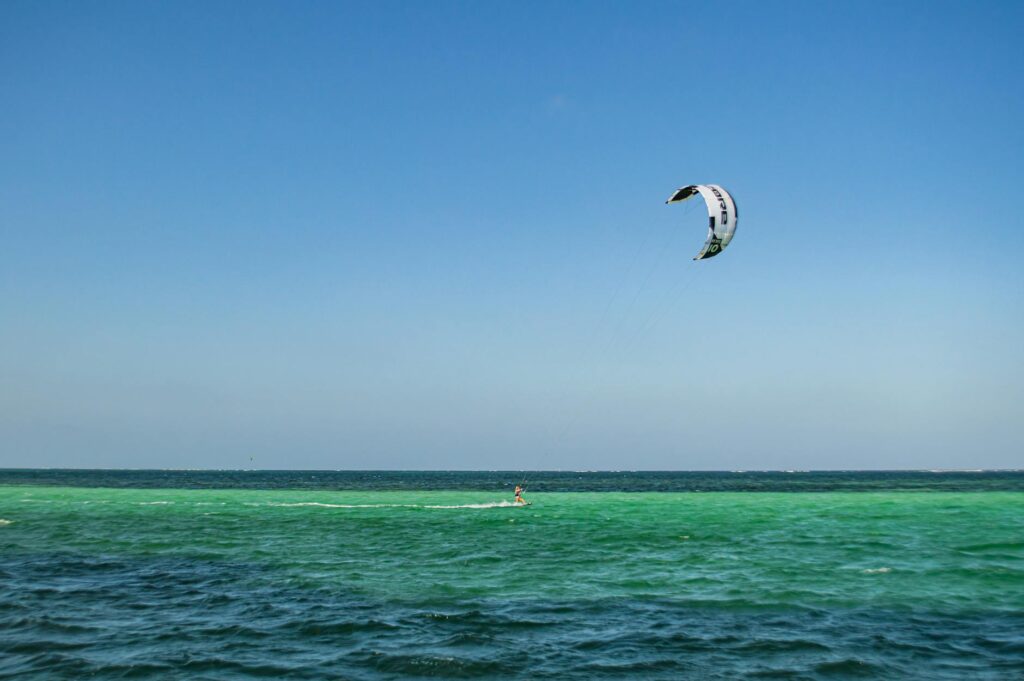 person on body of water kitesurfing